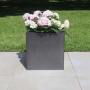 Massive trough planters overflowing with greenery
